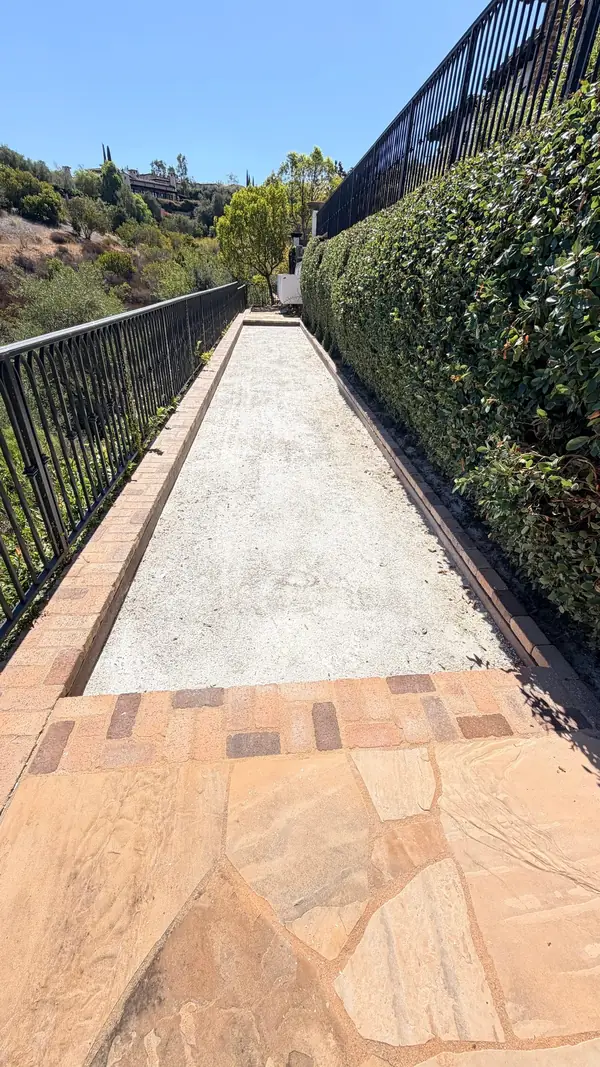 A bocce ball court along the hedge