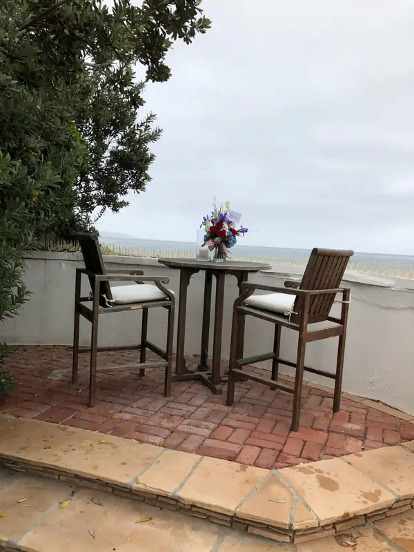 A brick terrace looking out to the ocean