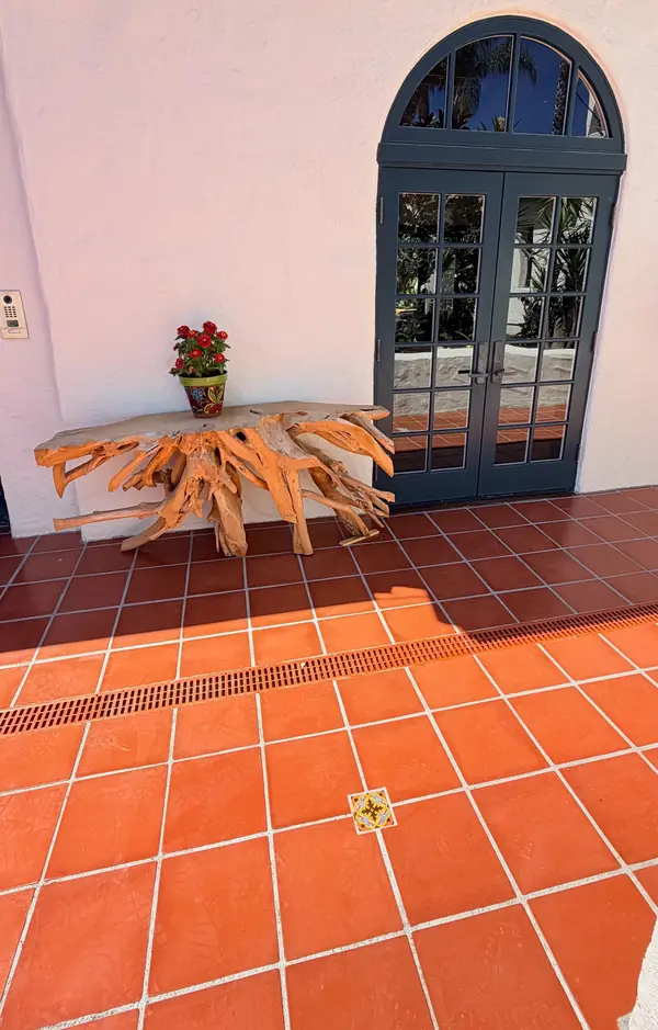 Restored terracotta tile with a Talavera accent set in