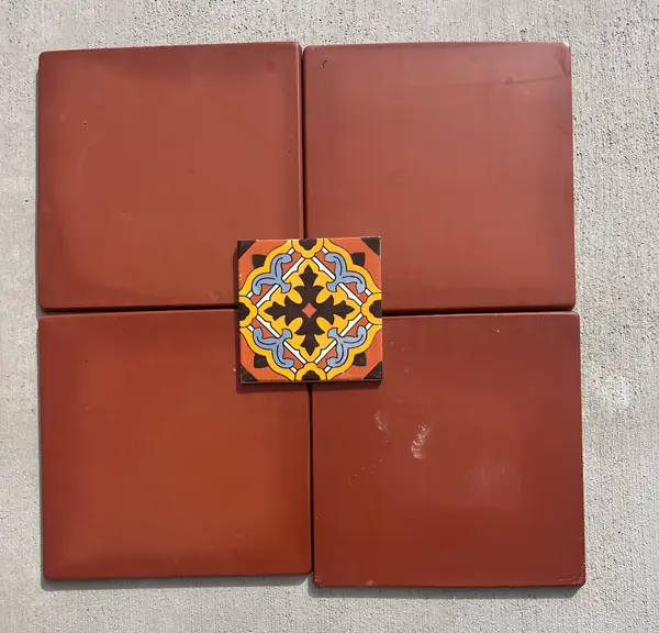 Laying out terracotta with a Talavera accent at the center