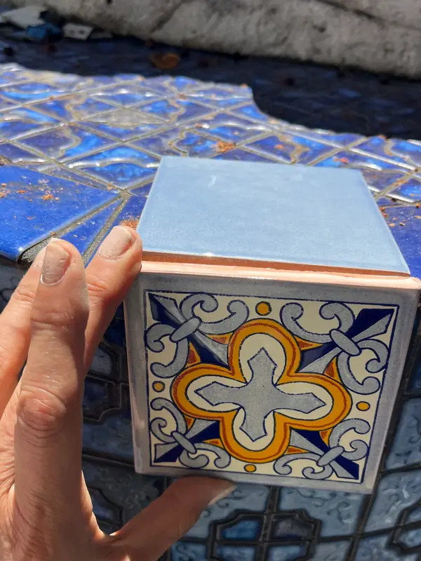 Testing a soft blue tile and a Talavera tile against the old navy fountain