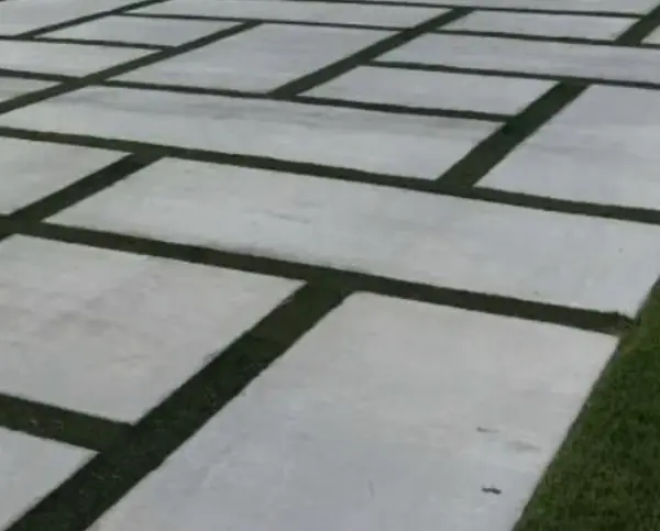 Concrete pavers set in artificial turf